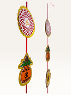 Paper Party Studio festive door hanging with layered cardstock auspicious motifs on a red cord for Diwali decor.