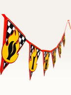 Paper Party Studio personalised racing birthday banner with checkered flags and yellow flame letter cutouts