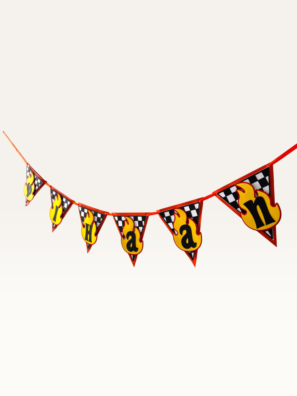 Paper Party Studio personalised racing birthday bunting with checkered flags and yellow flame letter pennants.