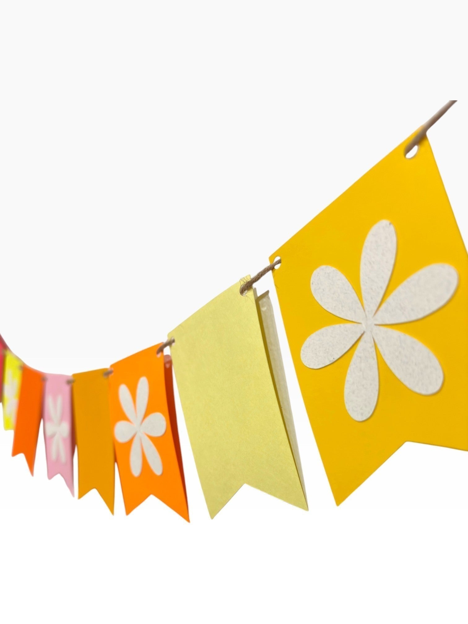 Paper Party Studio bright multi-color fishtail bunting with white flower cut-outs on alternating flags.
