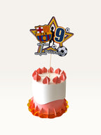 Paper Party Studio personalised football star cake topper with name and age on a decorated birthday cake