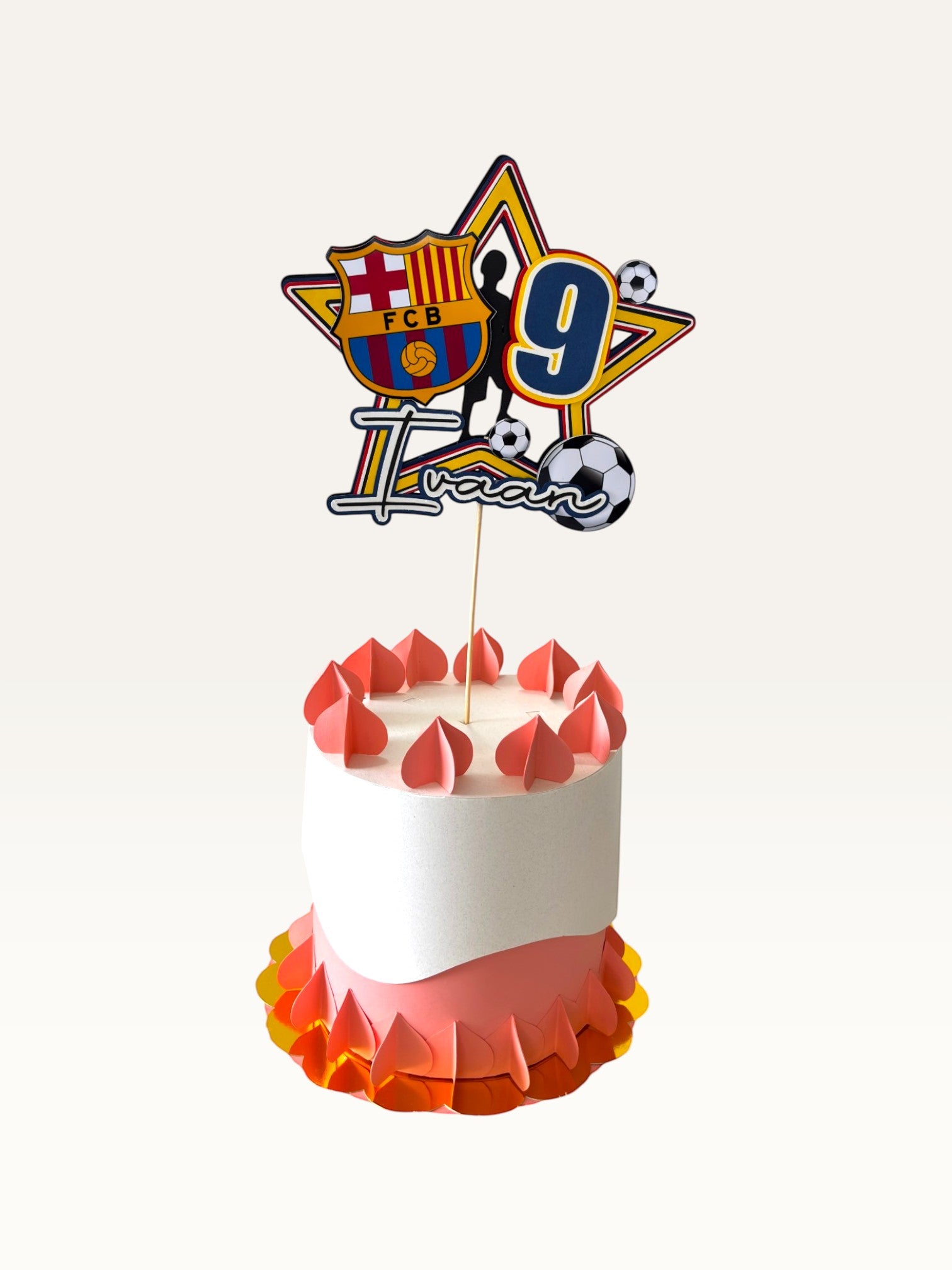 Paper Party Studio personalised football star cake topper with name and age on a decorated birthday cake