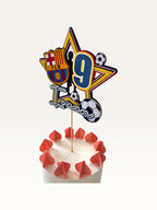 Paper Party Studio personalised football star cake topper with player silhouette, number 9, and soccer ball accents.