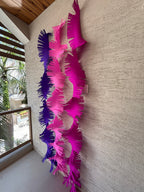 Paper Party Studio purple and pink crepe paper fringe streamers, hand-cut for a fluttery backdrop.