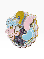 Paper Party Studio "Boy or Girl?" glitter shaker cake topper with pink and blue baby feet and gold foil details.