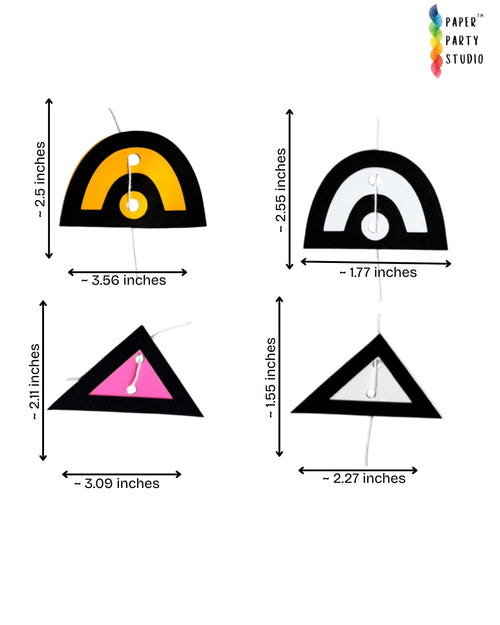 Paper Party Studio boho geometric paper hanging backdrop with black, mustard, pink, and white arches and triangles.