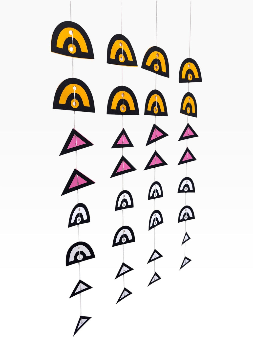 Paper Party Studio boho backdrop set with 4 strands of geometric paper hangings in black, yellow, pink, and white.