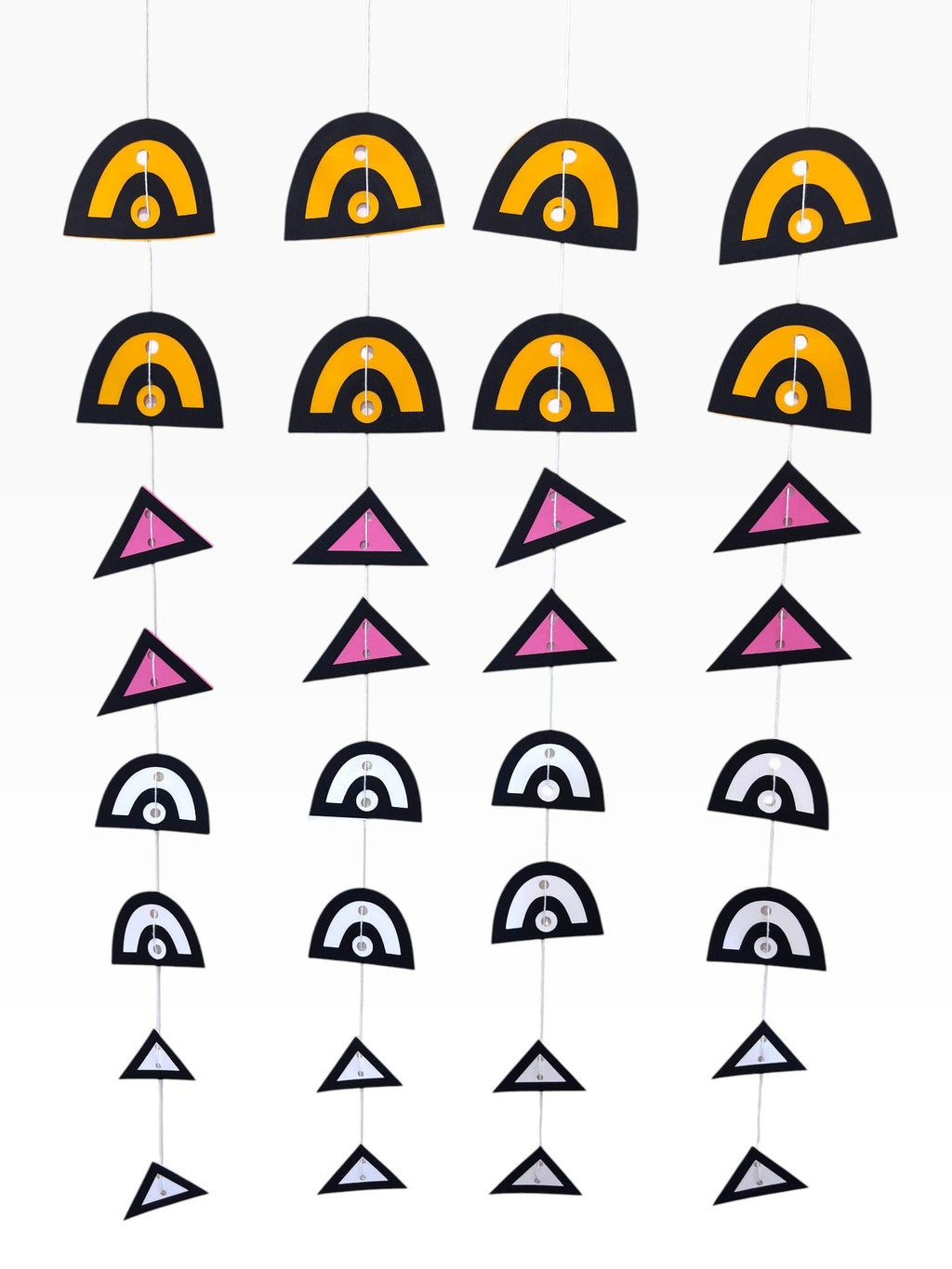 Paper Party Studio geometric paper hanging backdrop set with arches and triangles in black, yellow, pink, and white.