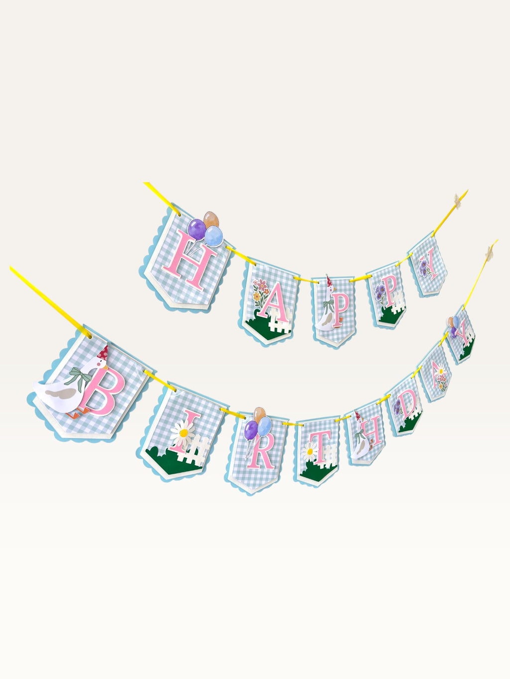 Paper Party Studio Gingham Garden Happy Birthday banner with pastel blue gingham flags, pink letters, and floral art.