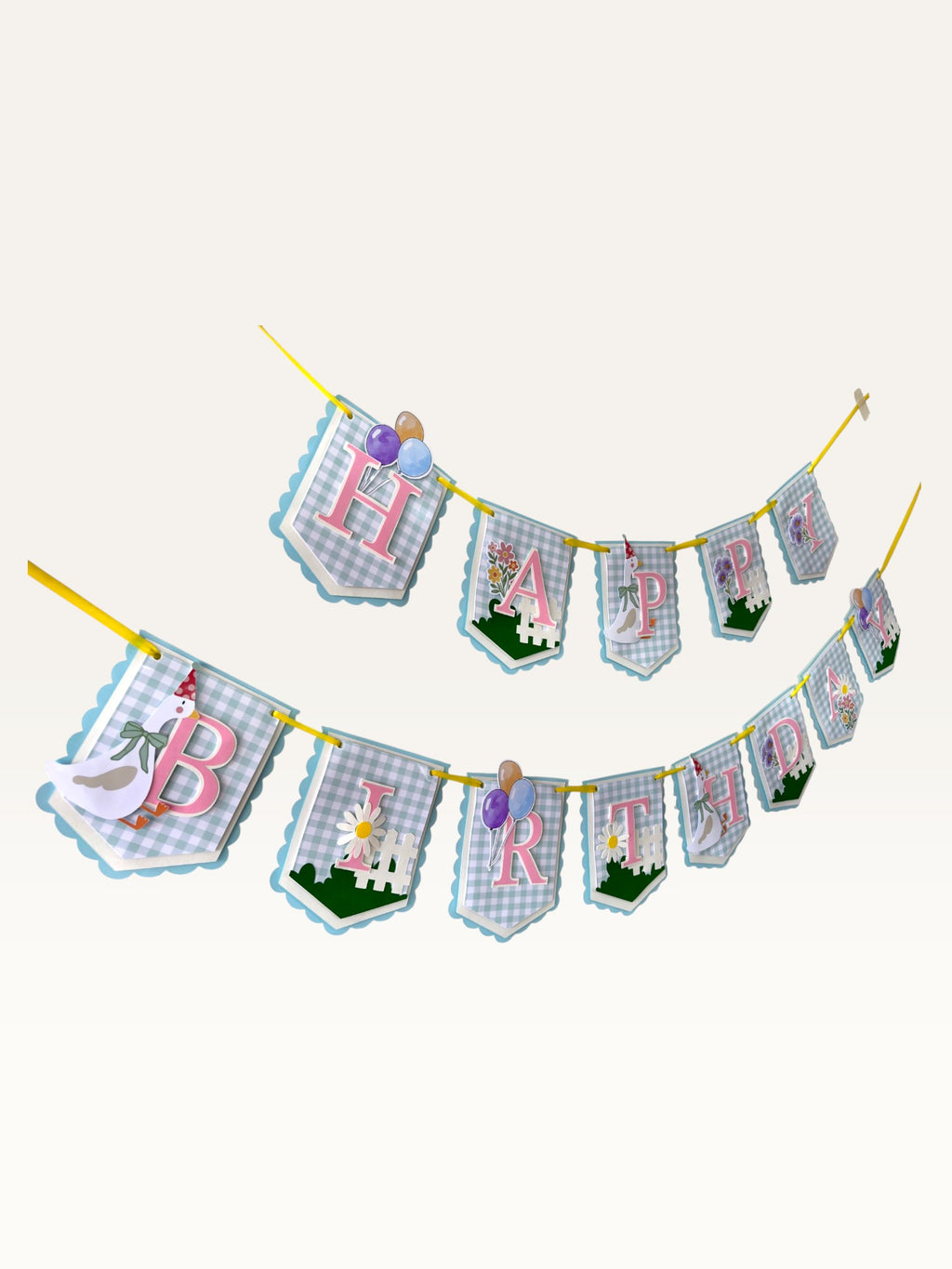 Paper Party Studio Happy Birthday banner with blue gingham flags, pink letters, daisies, and a party-hat goose.