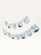 Paper Party Studio Happy Birthday banner featuring blue gingham flags, pink letters, daisies, and a party-hat goose.
