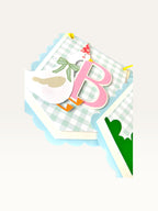 Paper Party Studio birthday banner featuring a blue gingham flag with a pink letter B and a goose in a party hat.