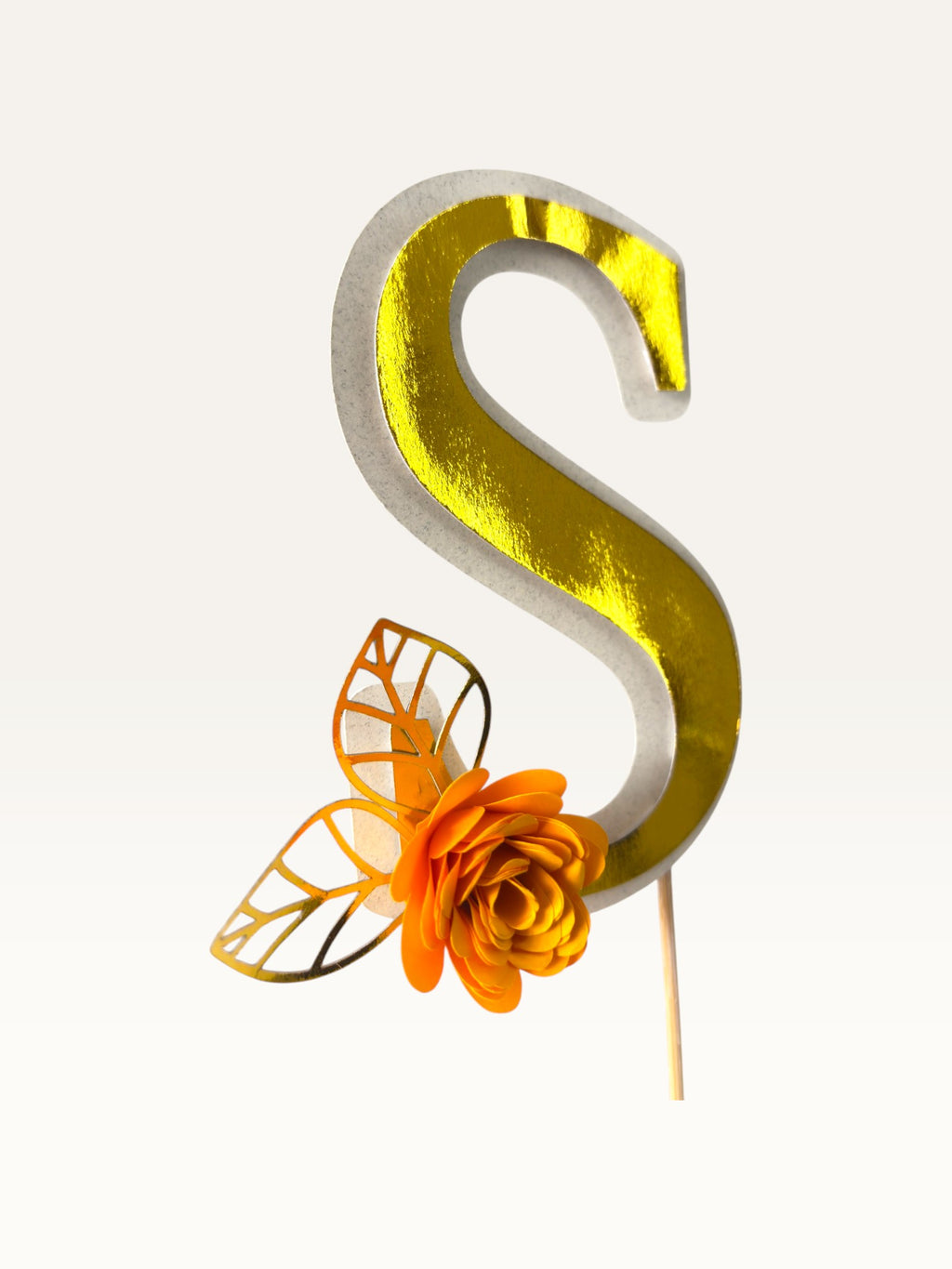 Paper Party Studio personalised gold foil letter S cake topper with an orange paper flower and gold foil leaf