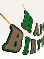 Paper Party Studio green and brown layered paper Happy Birthday banner with dimensional cut-out letters on a cord.