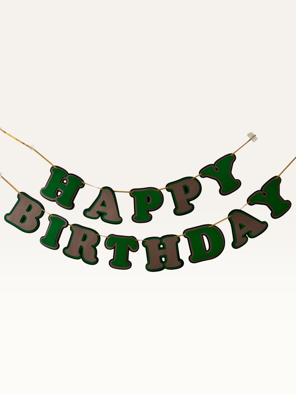 Paper Party Studio green and brown layered paper Happy Birthday banner with dimensional cut-out letters on a cord.