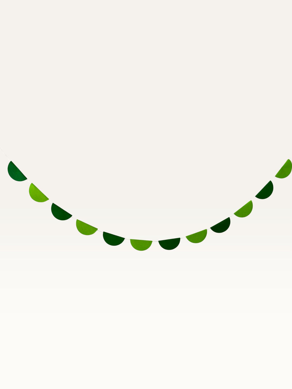 Paper Party Studio green scallop string garland for jungle safari birthday party decorations