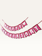 Paper Party Studio pink and white Happy Anniversary cardstock bunting banner with heart accents on swallowtail flags.