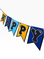 Paper Party Studio blue, sky blue, and gold paper birthday banner with bubble letters on swallowtail flags.