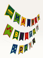 Paper Party Studio multicolour swallowtail Happy Birthday banner with cake, balloon, and star decorative tiles.