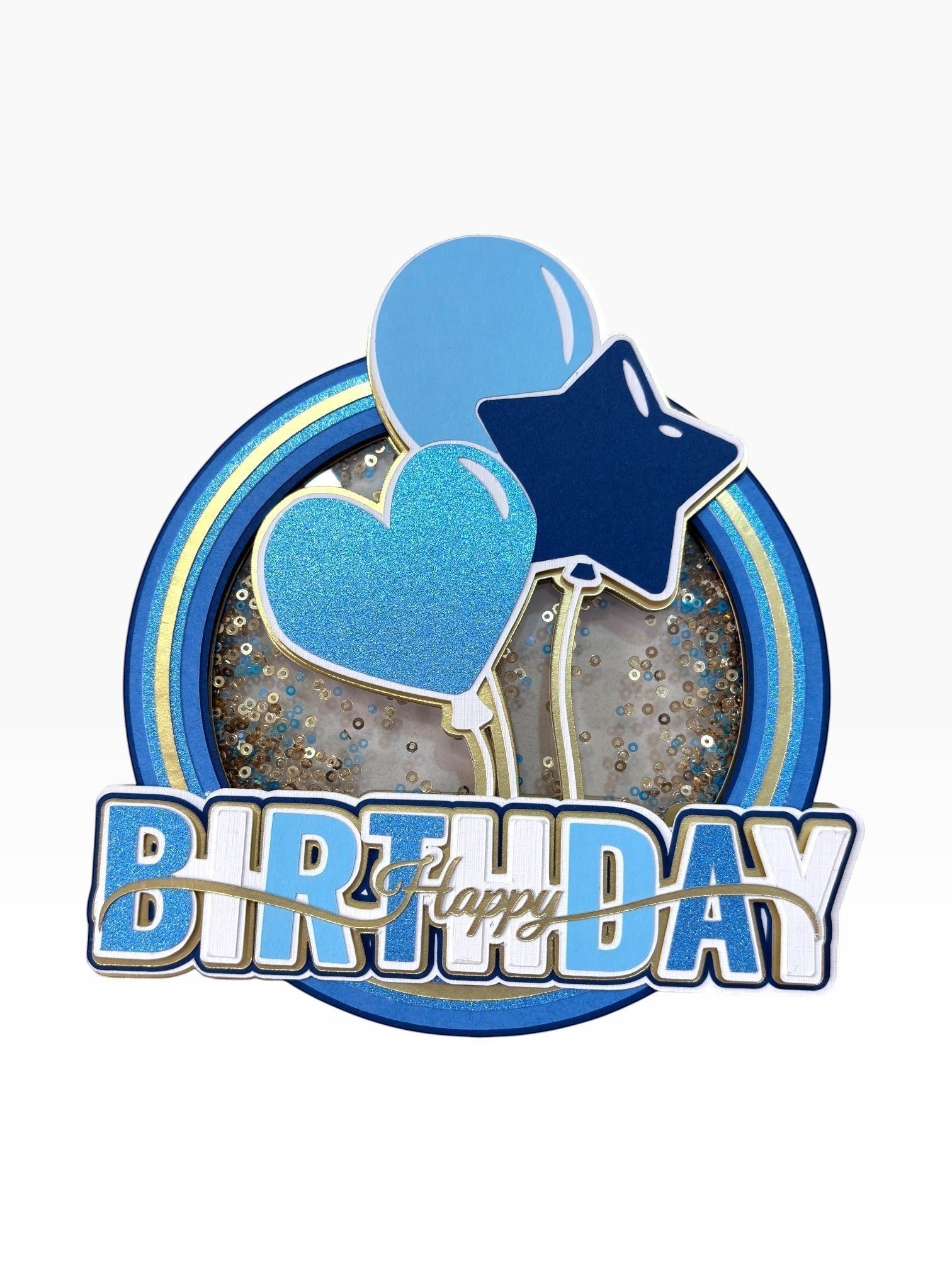 Paper Party Studio Happy Birthday shaker cake topper with blue glitter heart, star, and balloons, gold foil accents.