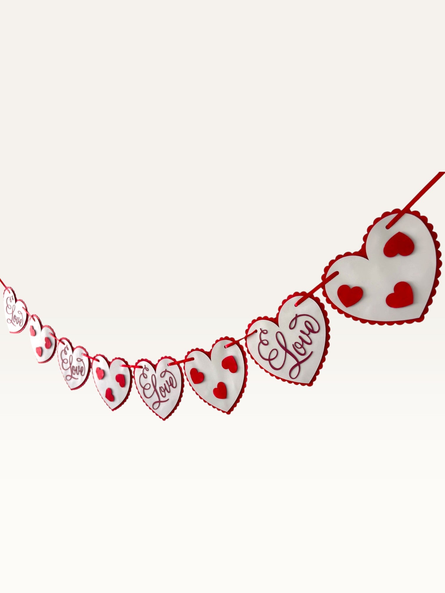 Paper Party Studio romantic heart bunting with scalloped white cardstock hearts on a red cord for Valentine's Day