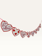 Paper Party Studio heart bunting with white scalloped cardstock hearts and red script on a red hanging cord.