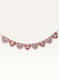Paper Party Studio heart bunting with white scalloped cardstock hearts and red script on a red hanging cord.