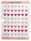 Paper Party Studio glossy heart sticker sheet with rows of pink, red, and lilac hearts for journals and crafts.