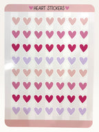 Paper Party Studio glossy heart sticker sheet with rows of pink, red, and lilac hearts for journals and crafts.