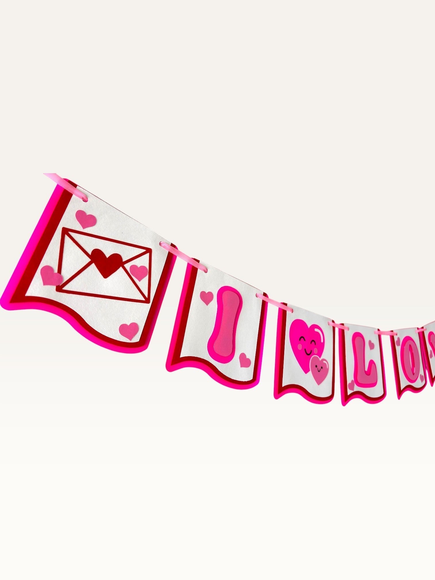 Paper Party Studio I Love You paper banner with pink hearts and love letter illustrations for romantic celebrations.