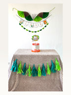 Paper Party Studio jungle safari birthday decoration set with personalised banner, cake topper, and paper tassels.