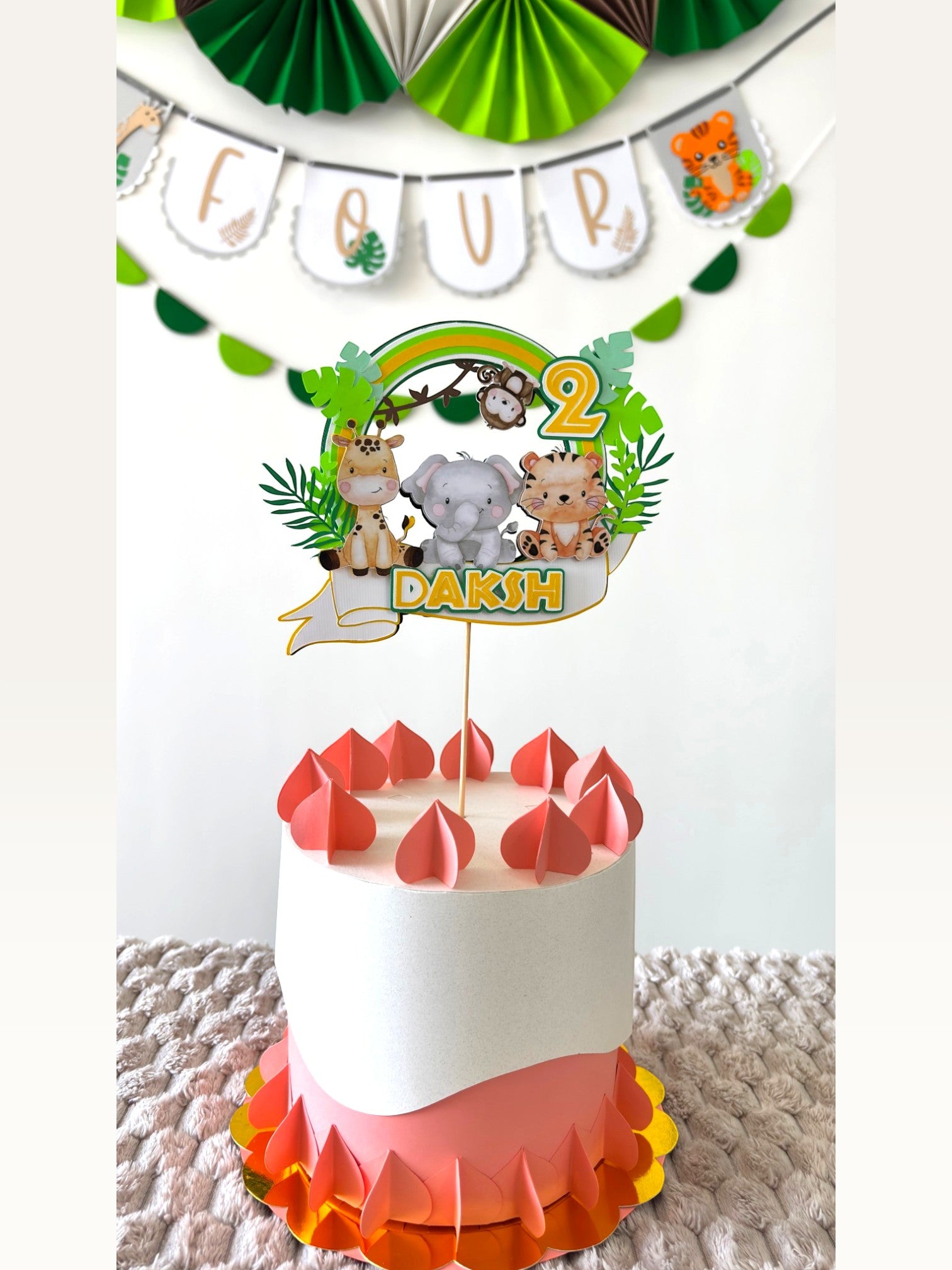 Paper Party Studio jungle safari birthday cake topper with giraffe, elephant, and tiger, featuring name and age.