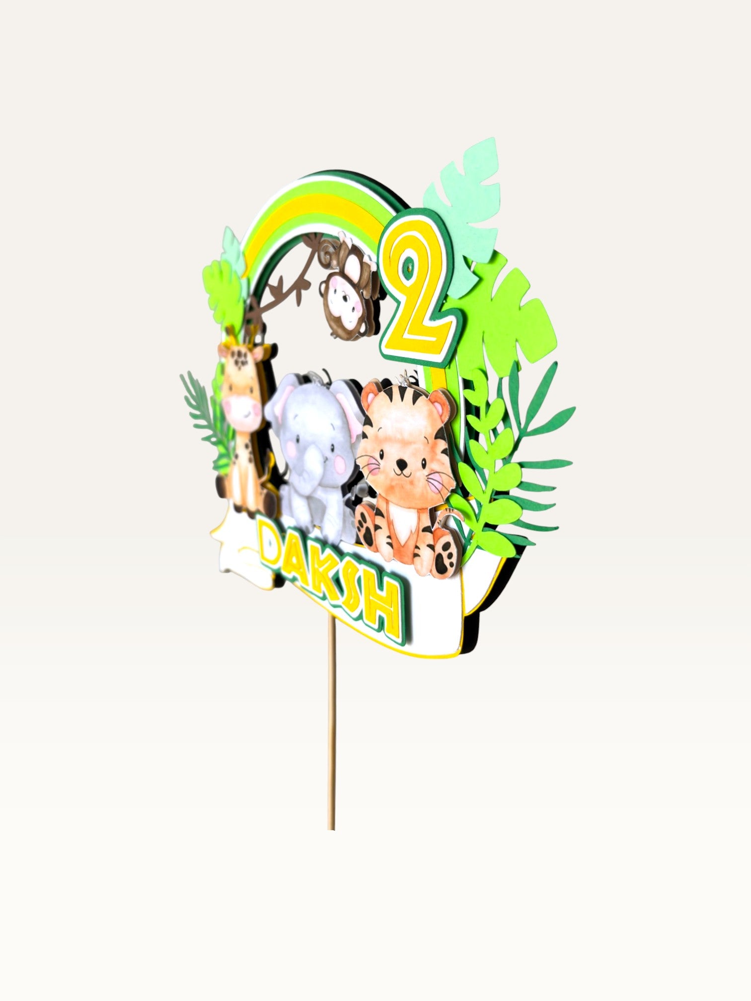 Paper Party Studio personalised jungle safari cake topper with giraffe, elephant, tiger, and monkey on a green wreath