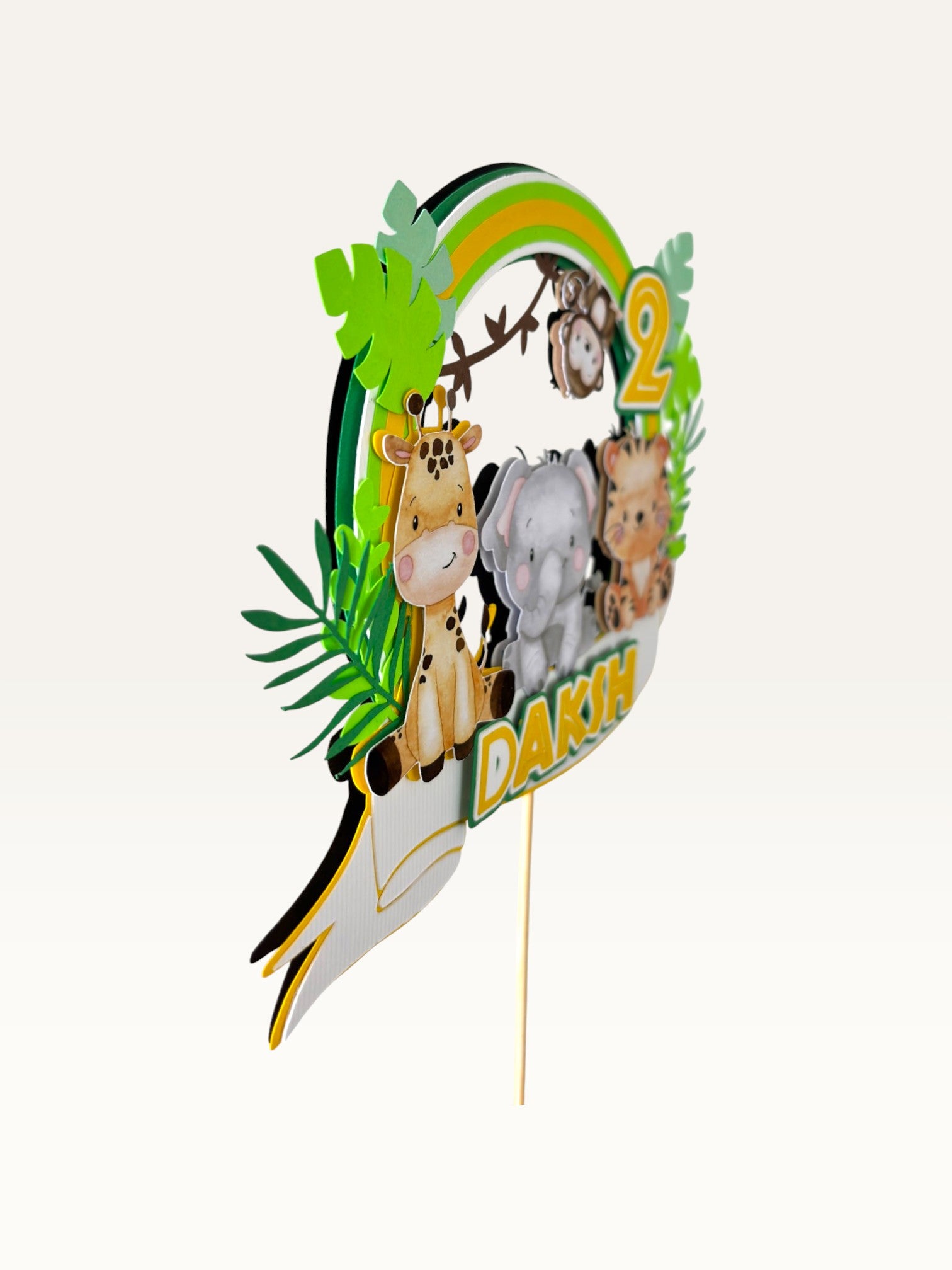 Paper Party Studio personalised jungle safari cake topper with layered animals, rainbow arch, and child's name and age.