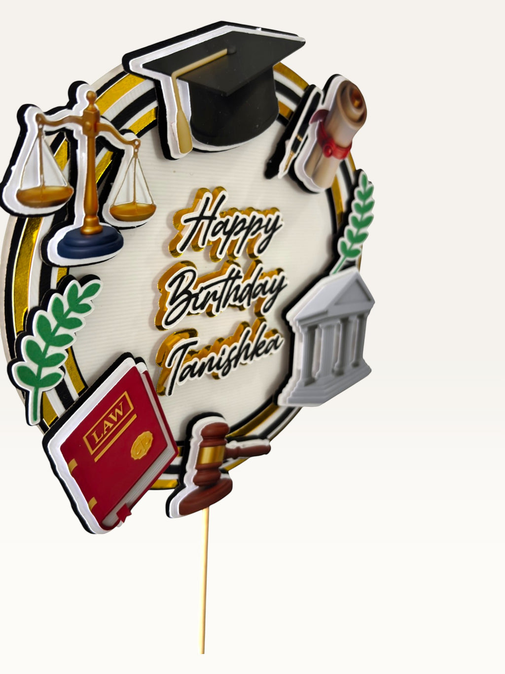 Paper Party Studio personalised 3D law-themed cake topper with scales, gavel, and graduation cap in black and gold.