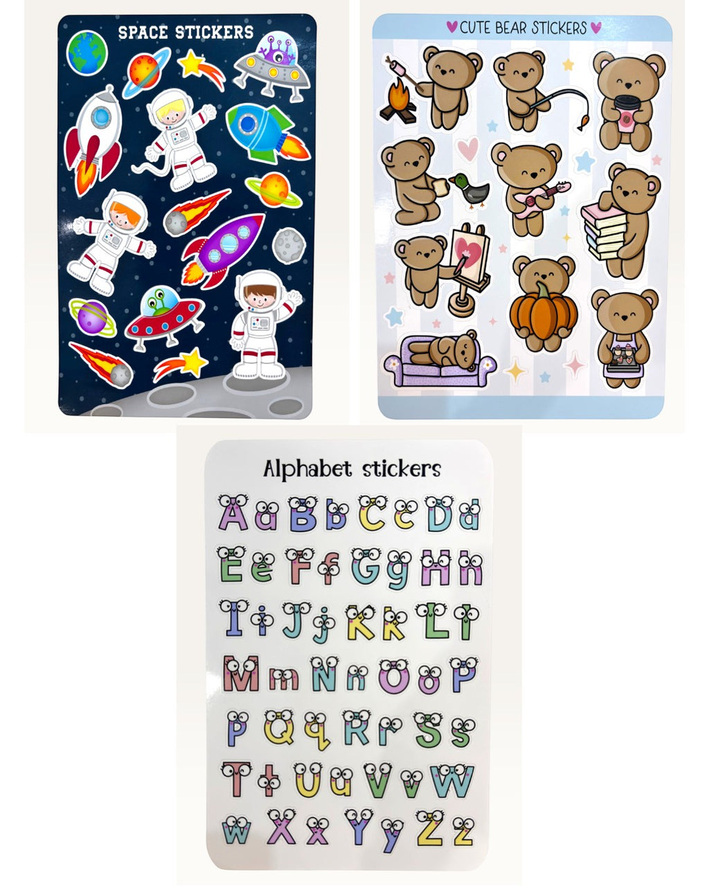 Paper Party Studio Little Explorer sticker set featuring space, cute bear, and alphabet designs on glossy sheets.