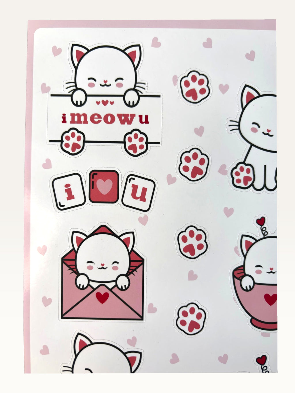 Paper Party Studio glossy sticker sheet featuring cute white cats, red hearts, paw prints, and I meow u text.