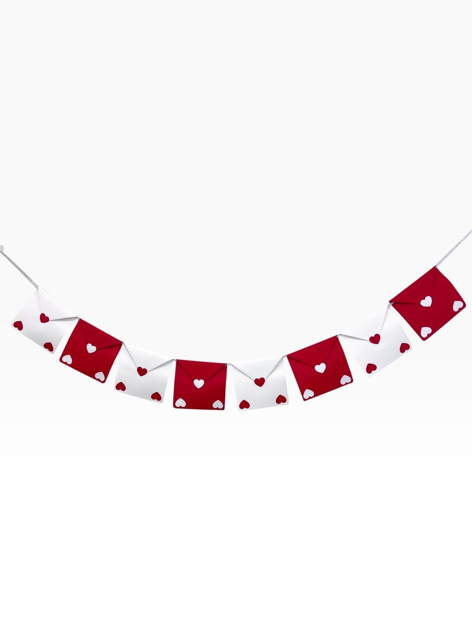 Paper Party Studio red and white envelope bunting with heart cut-outs, strung on silver cord.