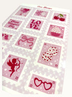 Paper Party Studio glossy sticker sheet featuring vintage-style pink postage stamps with hearts, cupid, and cherries.