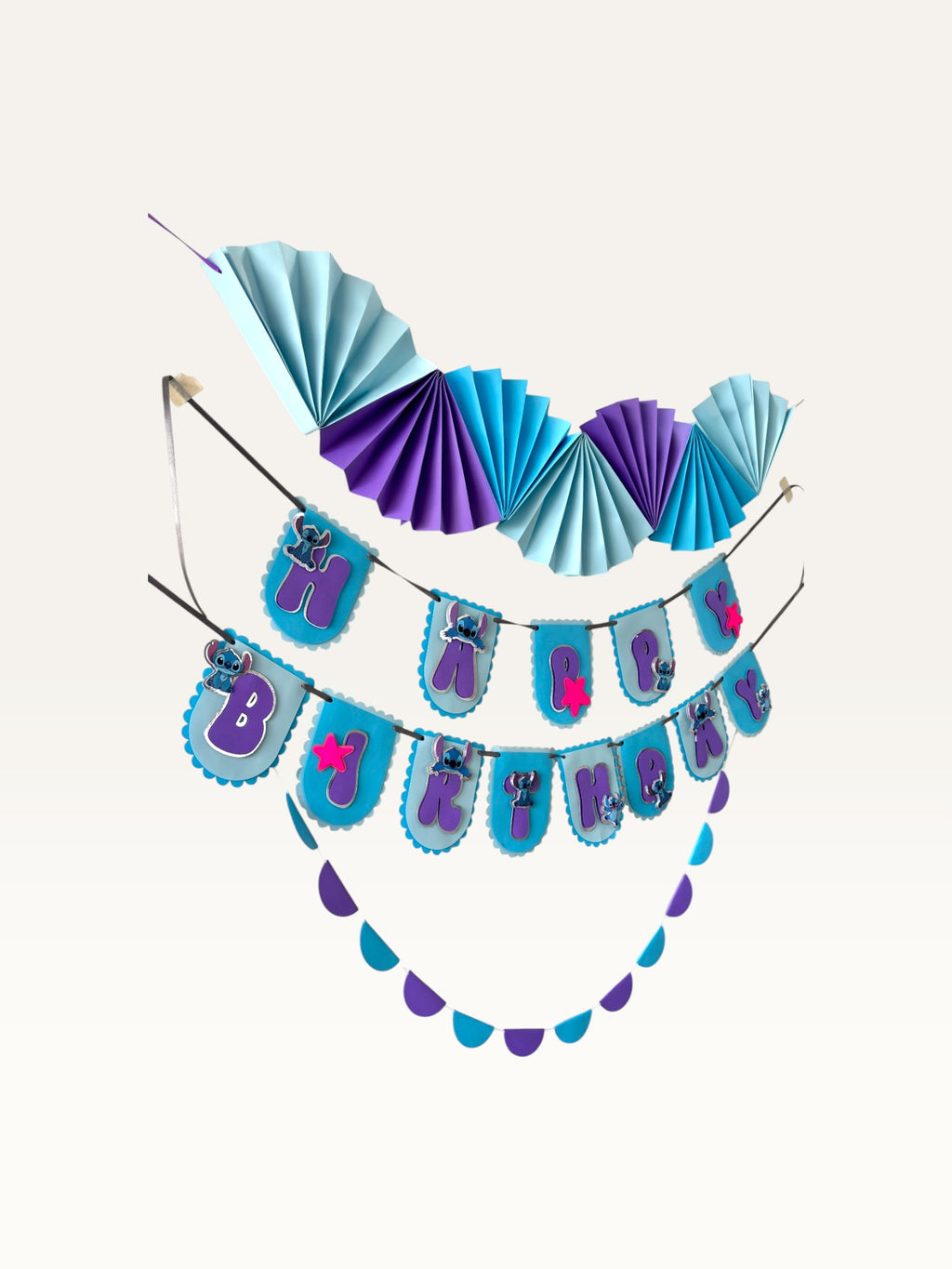 Paper Party Studio tropical luau birthday banner and fan backdrop set in blue and purple with alien character accents