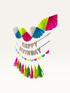 Paper Party Studio neon candy birthday party decoration set with fans, Happy Birthday banner, and tassel garland.
