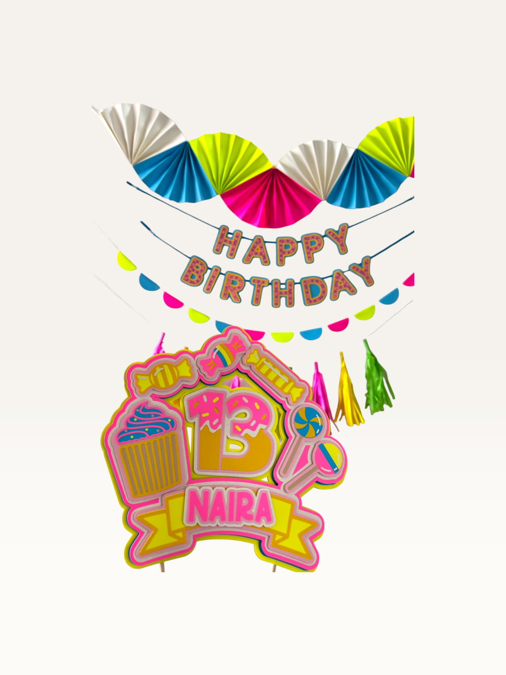 Paper Party Studio neon candy birthday party set with personalised cake topper, fans, banner, and tassel garland.