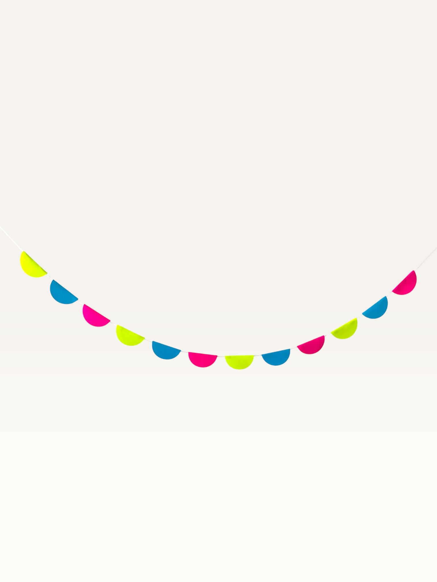 Paper Party Studio neon rainbow scallop garland featuring vibrant paper half-circles for nursery or party wall decor