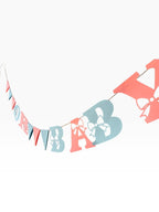 Paper Party Studio pink and blue cardstock 'Oh Baby' banner with bow cut-outs and triangle pennants.
