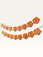 Paper Party Studio Om Namah Shivaya saffron pentagon banner with red borders and trishul accents for festive decor.