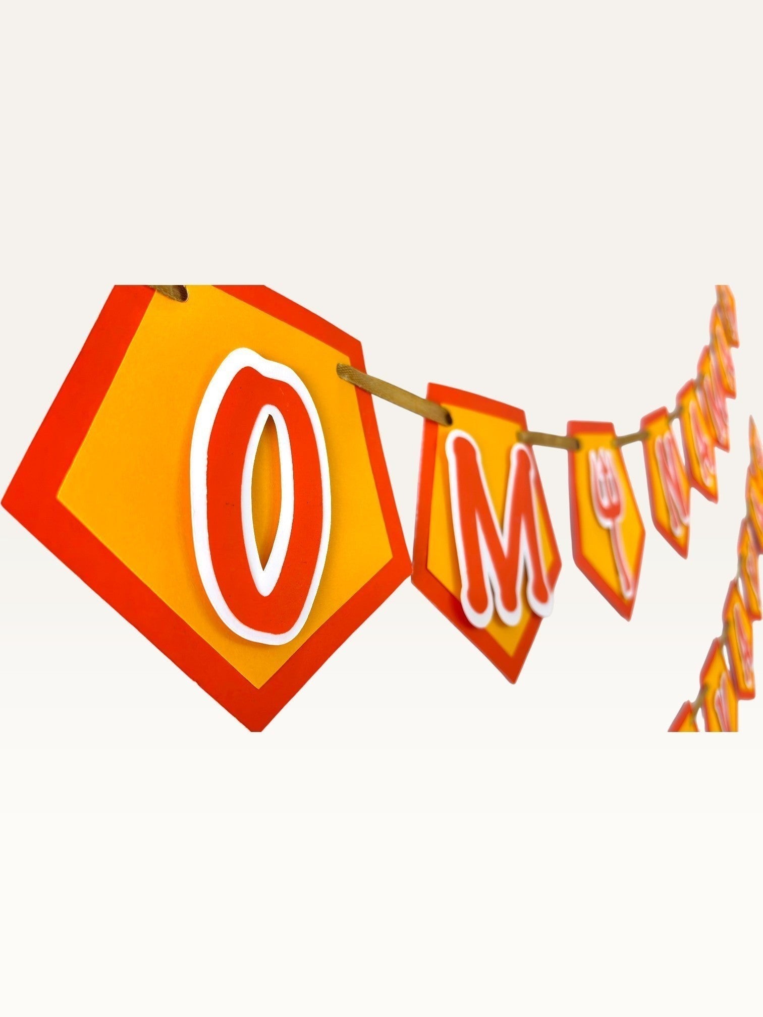 Paper Party Studio Om Namah Shivaya saffron pentagon bunting with red borders and trishul accents for festive decor.