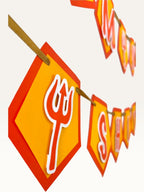 Paper Party Studio Om Namah Shivaya banner with saffron pentagon flags, red borders, and trishul accents for pooja.