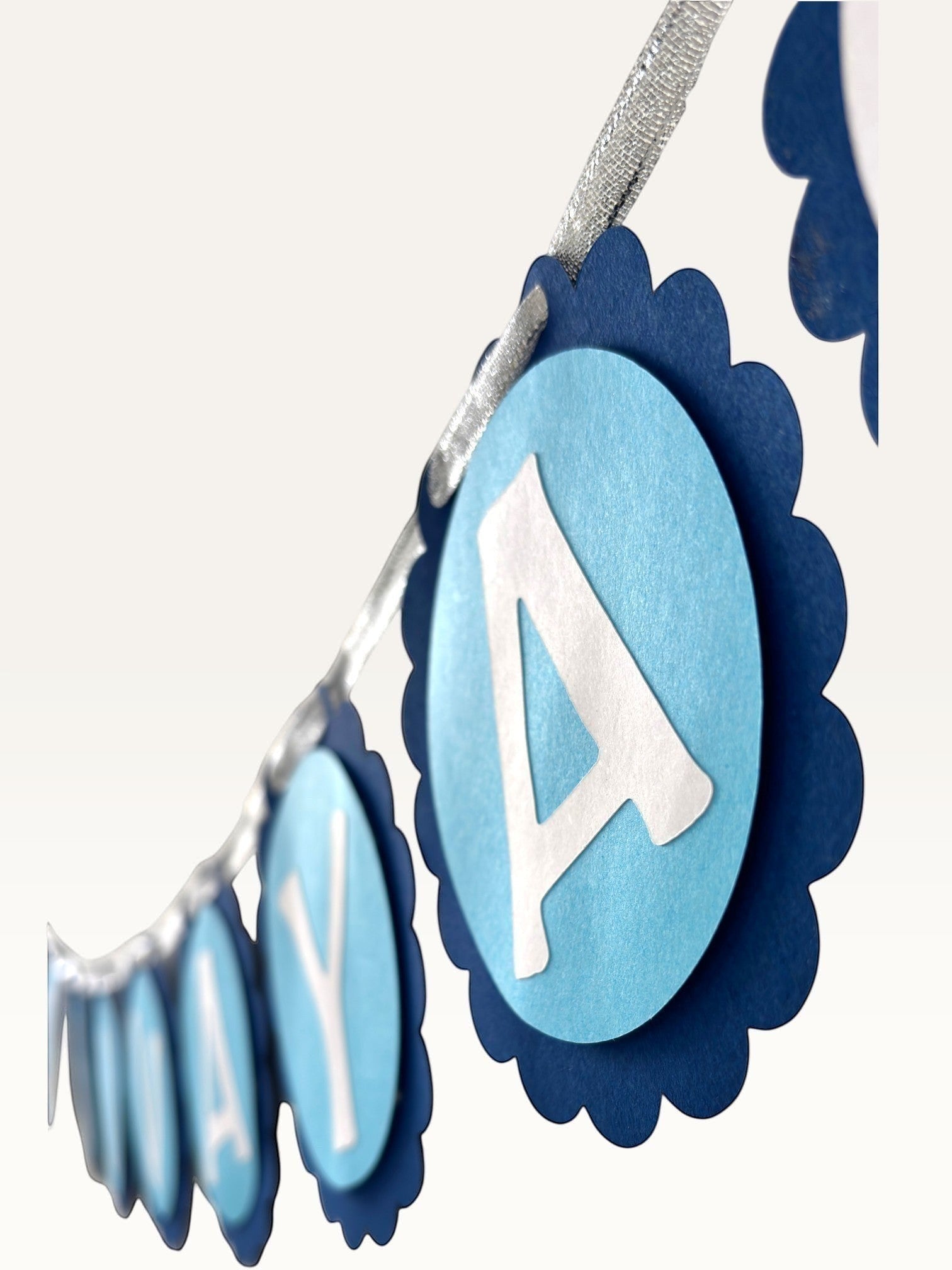 Paper Party Studio Om Namah Shivaya blue scalloped paper bunting with white lettering for festive mandir decor.