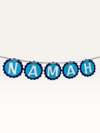 Paper Party Studio blue scalloped cardstock bunting spelling Namah for Mahashivratri and pooja home decor.