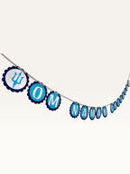 Paper Party Studio blue Om Namah Shivaya bunting with scalloped cardstock medallions and trishul accents.